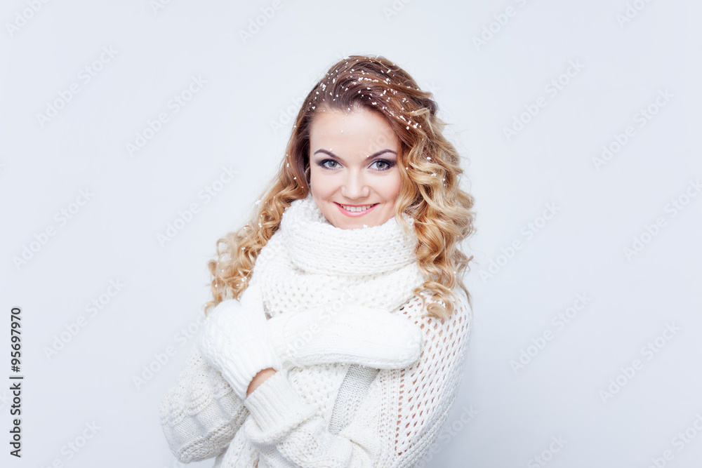 Woman in warm knitted scarf and gloves, portrait on white background, place for your text Woman in warm knitted scarf and gloves, portrait on white background, place for your text