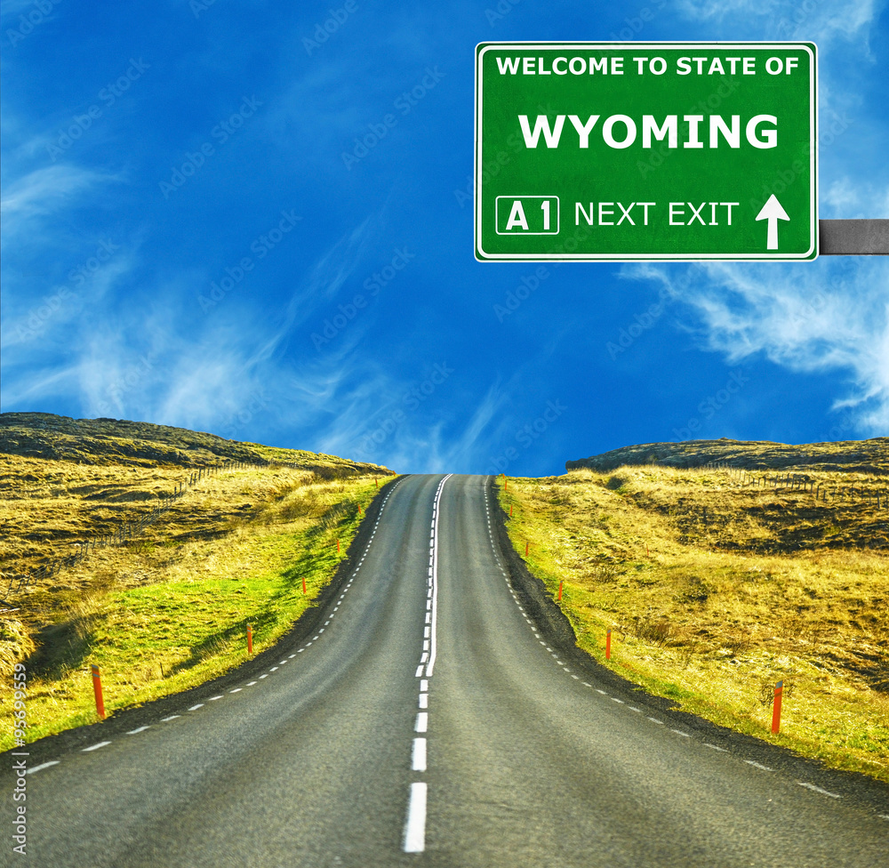 WYOMING road sign against clear blue sky