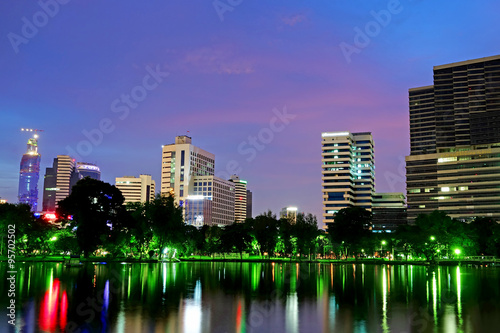 Lake view of Lumpini Park in the Thai capital's city centre on october 10, 2014 in Bangkok, Thailand. Lumpini Park covers 142 acres with 2.5 km of pathways and a large boating lake.