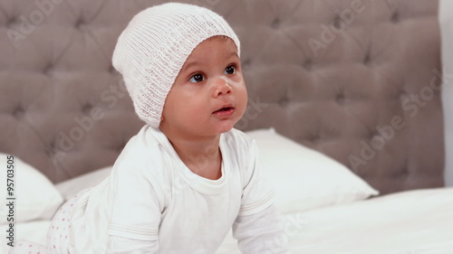  Baby in white clothes crawling 