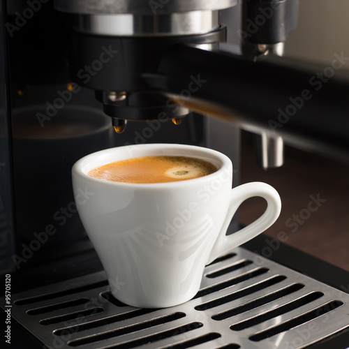 White ceramic cup of fresh espresso with foam