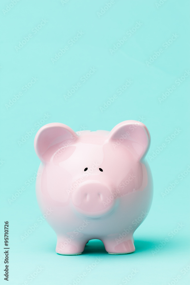Piggy bank on blue background
