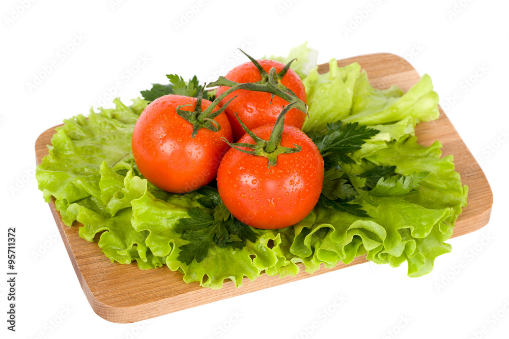 Fresh colorful vegetables on wooden board isolated on white Fresh colorful vegetables on wooden board isolated on white