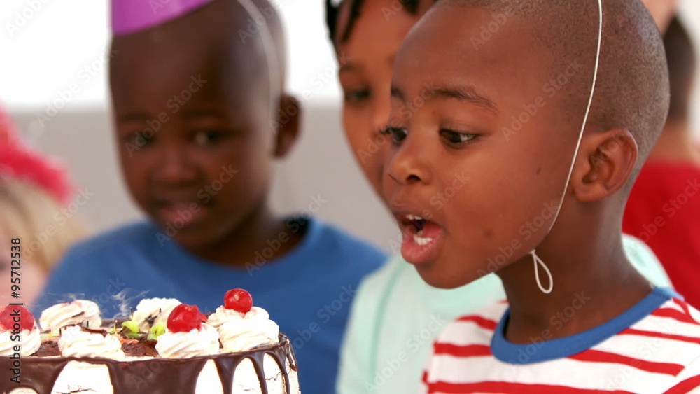 Birthday boy blowing out candles Birthday boy blowing out candles