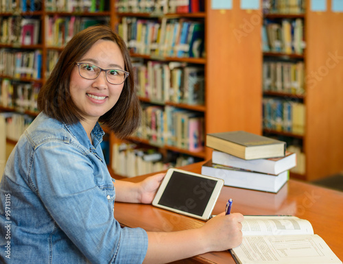 Student researching data in the library.