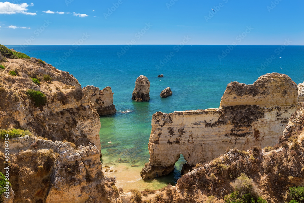 Summer panorama of sea landscape. The cliffs in Albufeira, Portugal.