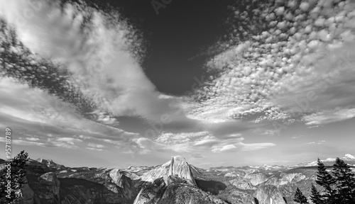 Black and white photo of cloudscape over Half Dome in Yosemite National Park.