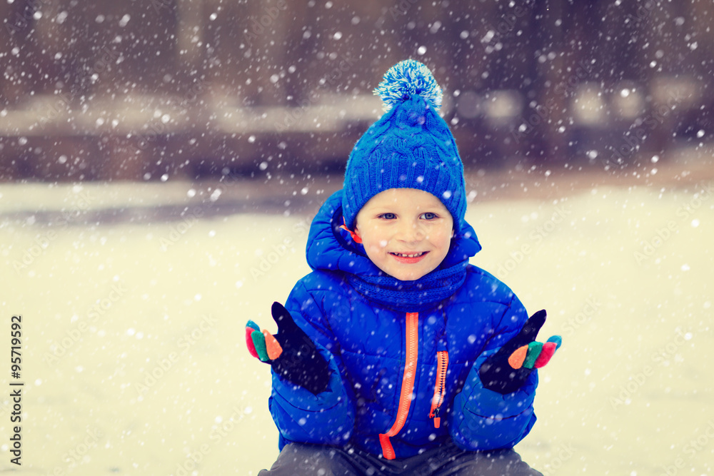 little boy enjoy first snow in winter nature little boy enjoy first snow in winter nature