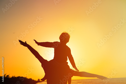 father and son having fun on sunset