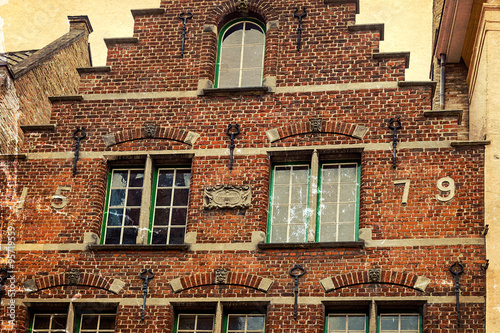 Architectural facade detail at one old building placed in Bruges,Belgium photo