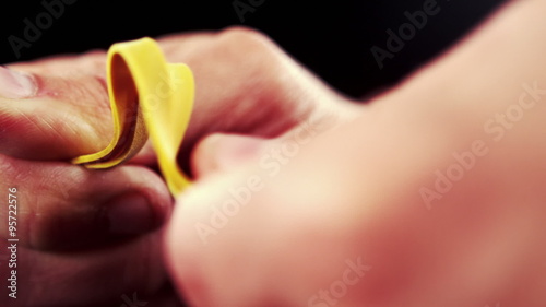 Hand pulling an elastic band