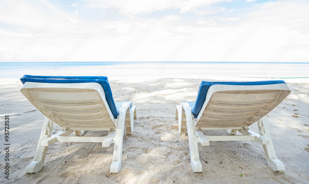 Beach chairs on the beach. Back view