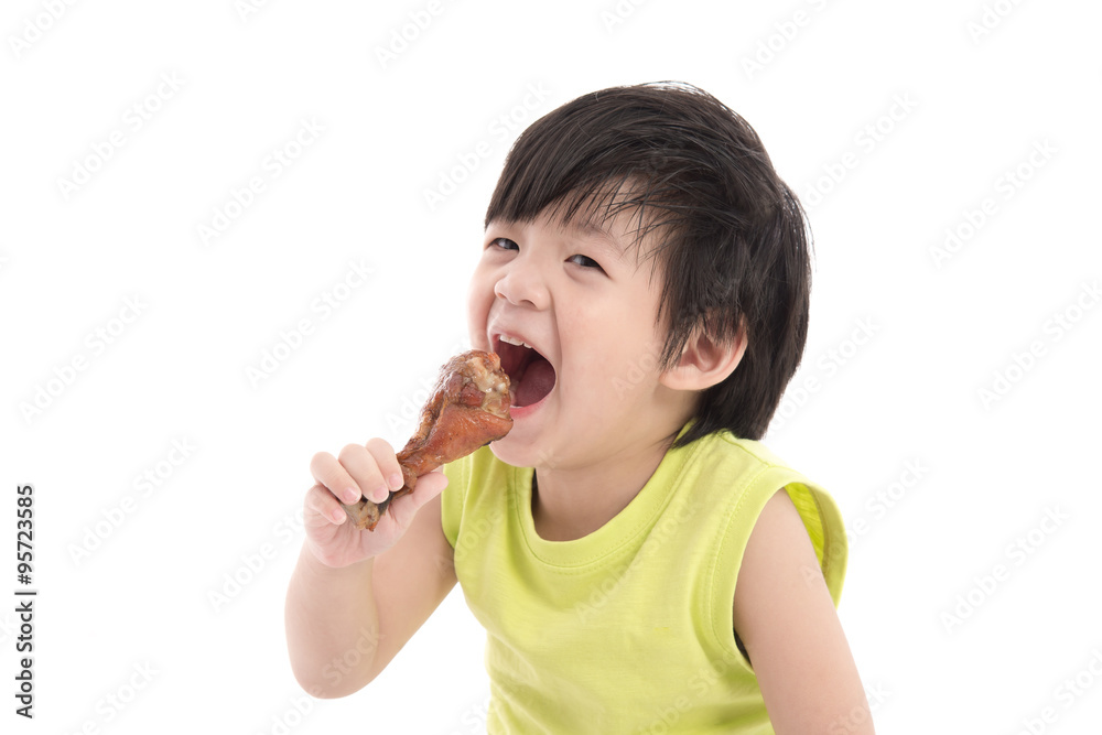 Cute asian boyeating roasted chicken Cute asian boyeating roasted chicken