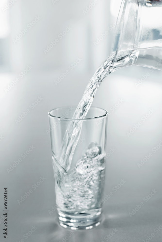 Drinking Water. Pour Water From Pitcher Into A Glass. Health, Diet, Hydratation Concept.