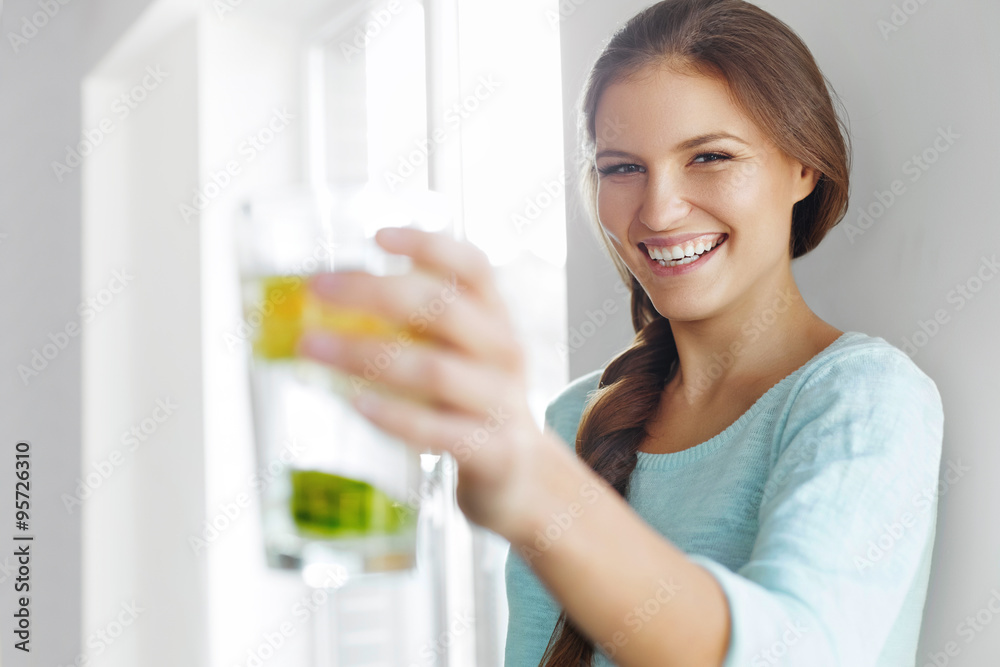 Healthy Lifestyle Concept, Diet And Fitness. Woman Drinking Water With Lemon , Lime And Mint Healthy Lifestyle Concept, Diet And Fitness. Woman Drinking Water With Lemon , Lime And Mint