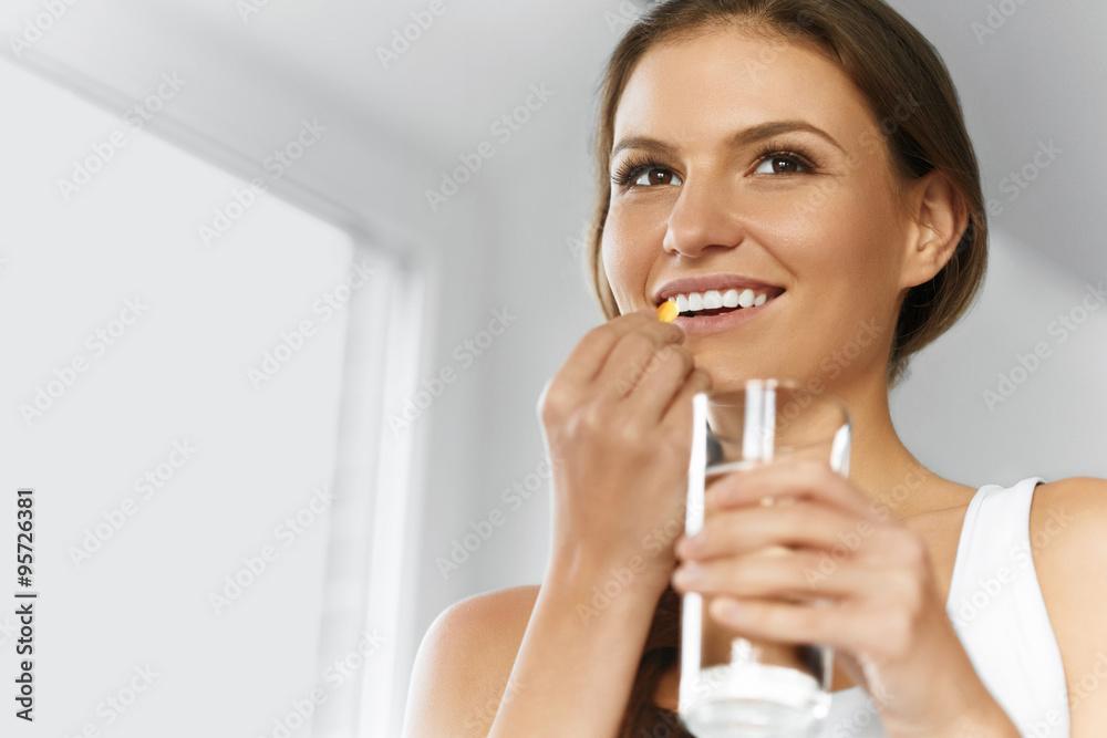 Vitamins. Healthy Diet. Healthy Eating, Lifestyle. Girl With Cod Liver Oil Omega-3 Pill. Nutrition. Vitamins. Healthy Diet. Healthy Eating, Lifestyle. Girl With Cod Liver Oil Omega-3 Pill. Nutrition.