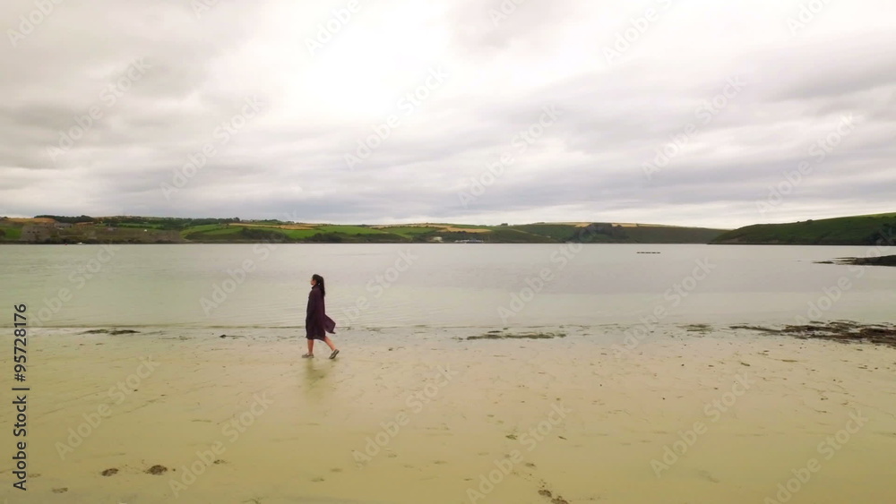 Pretty girl walking on the sand Pretty girl walking on the sand