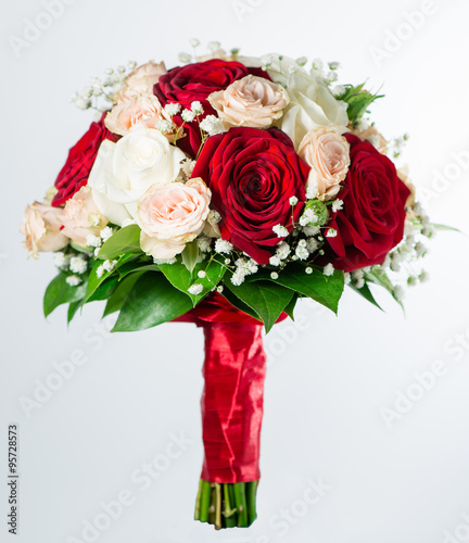 red bridal bouquet isolated on white background  shallow DOF 