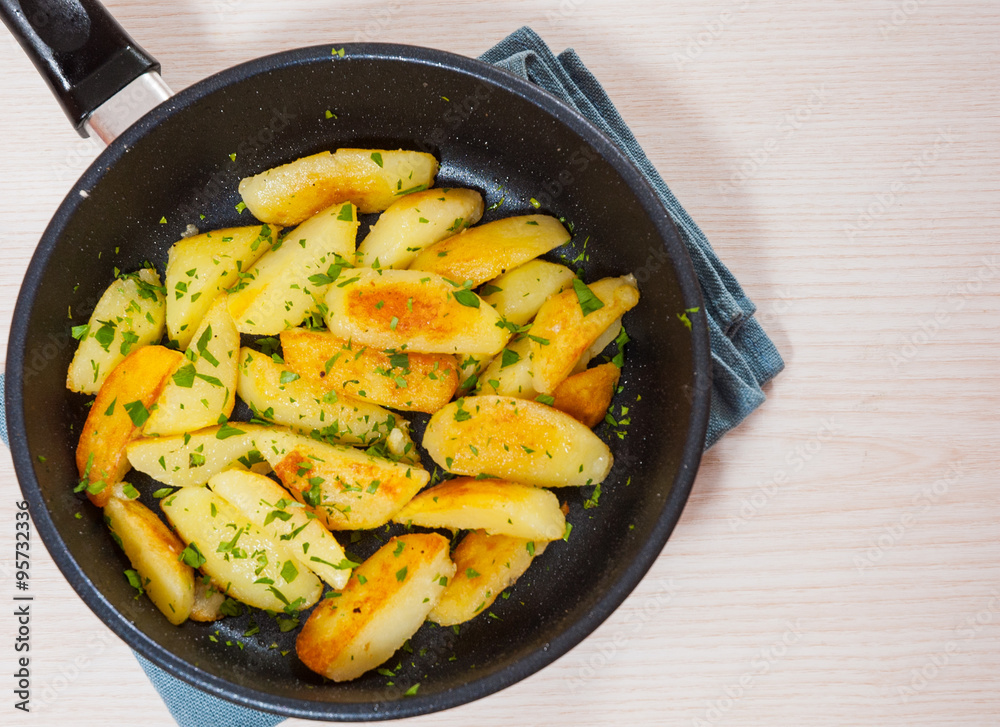 roasted potatoes in a frying pan roasted potatoes in a frying pan