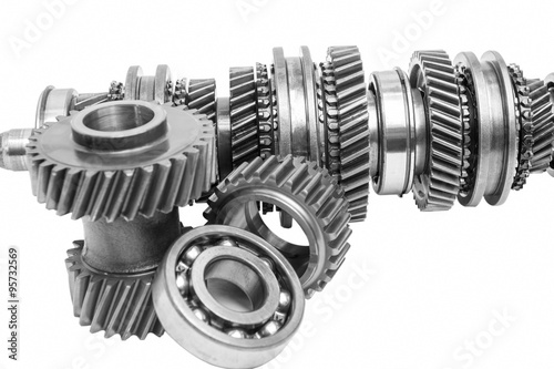 part of gearbox on black and white