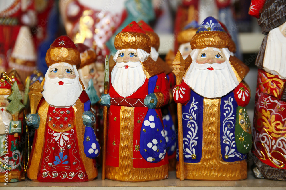 .Army of wooden santa claus puppets at christmas market