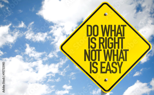 Do What Is What Not What Is Easy sign with sky background photo