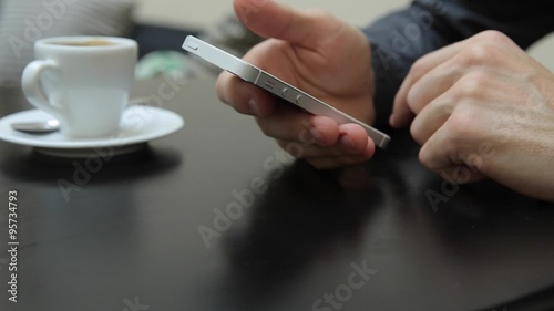 Hand Flipping Through Calendar on Touch Screen Mobile Device