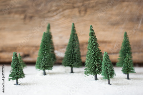 Obraz na płótnie Christmas card - a miniature Christmas tree in the snow - winter w salonie