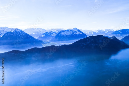 Panoramic skyline view of snow-capped mountains over lake Lucern © Stockphototrends