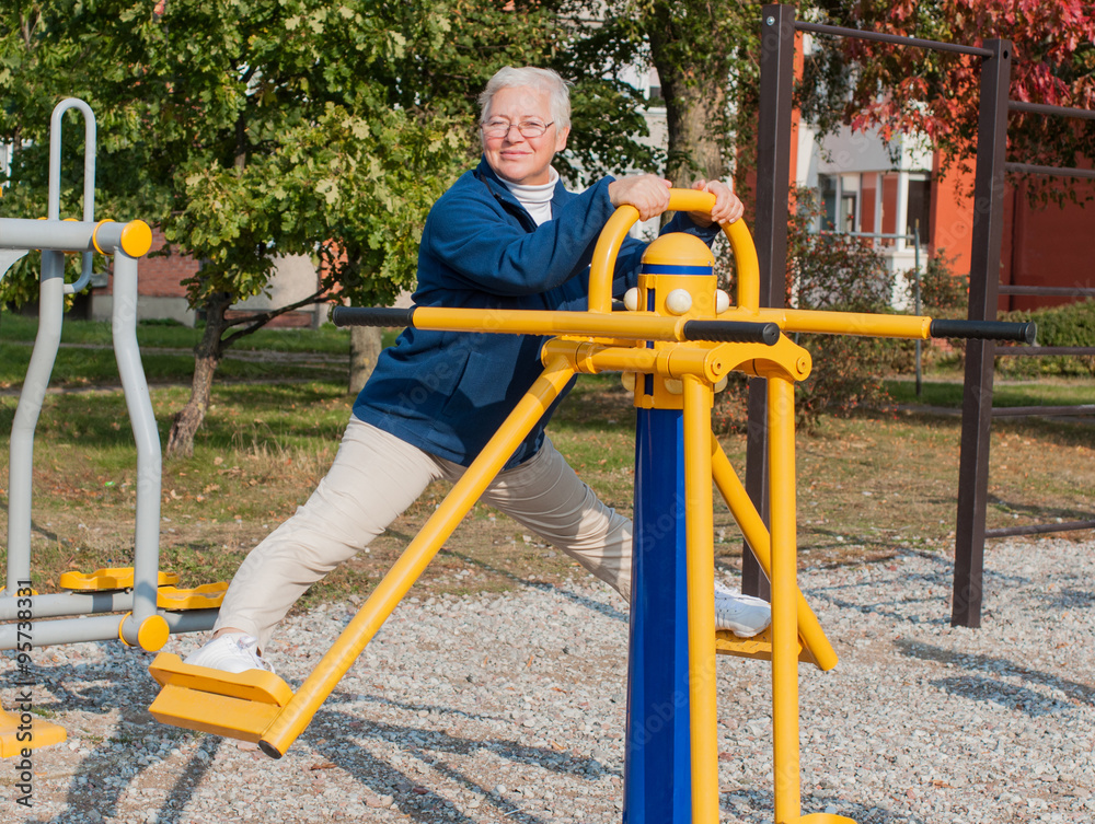 Fototapeta premium Senior woman doing exercise outdoors 