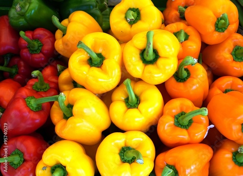 Colorful sweet bell peppers in bulk at the farmers market 
