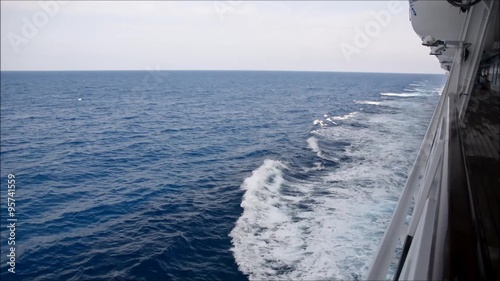 Side deck of cruise ship sailing at sea or ocean during the day