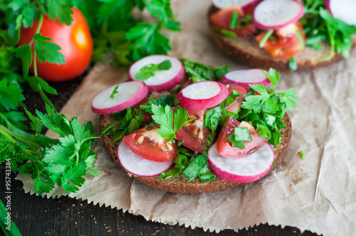 Italian tomato bruschetta with chopped vegetables, herbs and oil photo