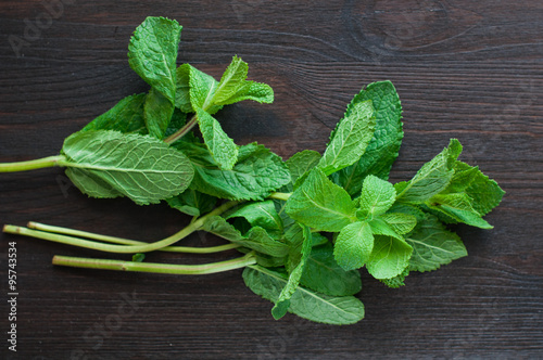 fresh mint leaves on the wooden background