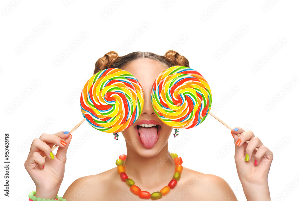 Girl eating colourful lollipop. Lollipop.  Isolated on white background