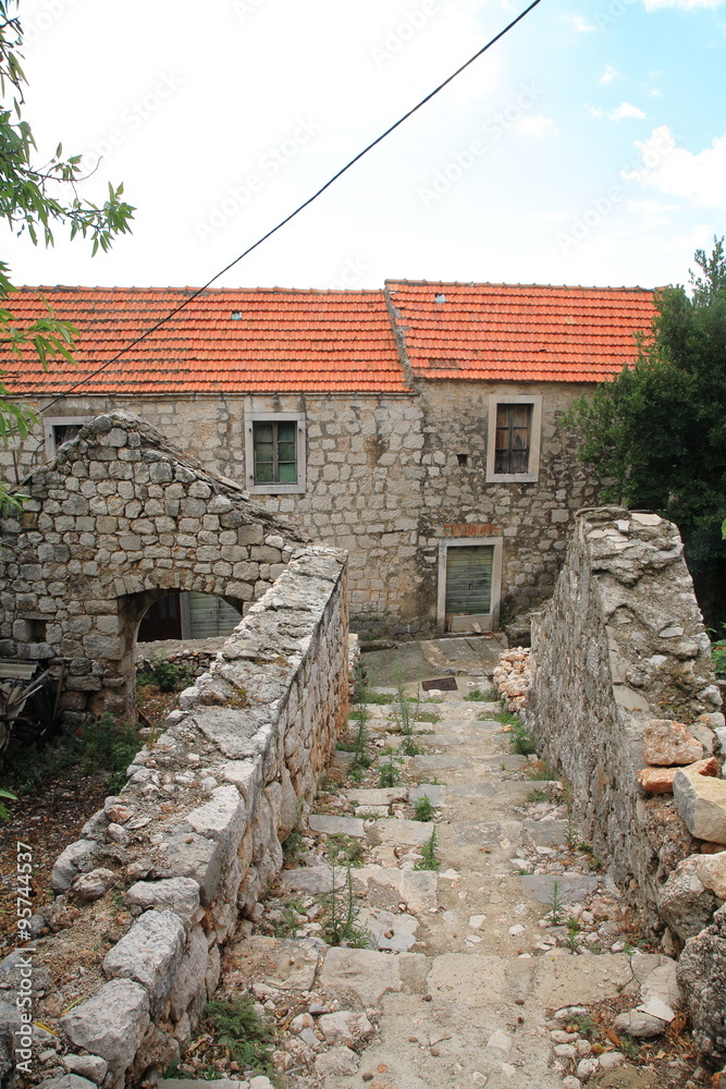 Stone house with a red roof