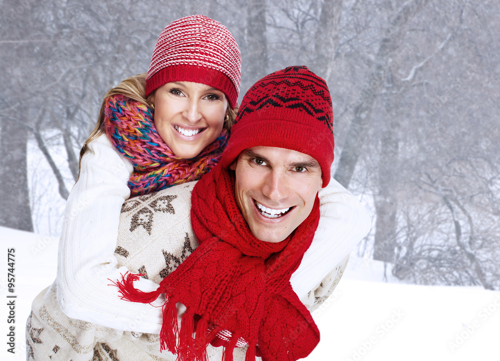 Happy christmas couple in winter clothing.
