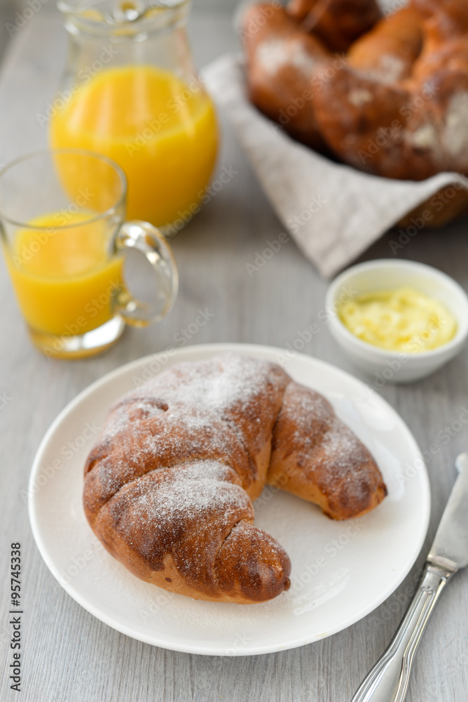 delicious breakfast with fresh croissants and orange juice