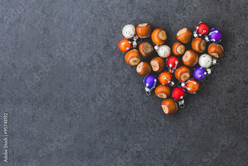 The heart of the hazelnuts and christmas decorations