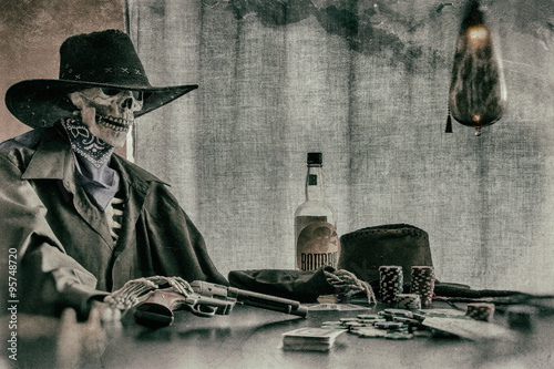 Old West Poker Playing Skeleton Gun. Old west bandit outlaw skeleton at a poker table with a pistol and bourbon, edited in vintage film style.