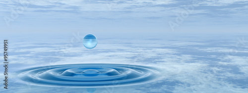 Conceptual blue liquid drop falling in water banner