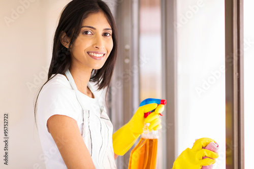young indian housewife doing house chores
