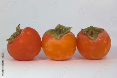 close-up of fabulous persimmon orange and green photo