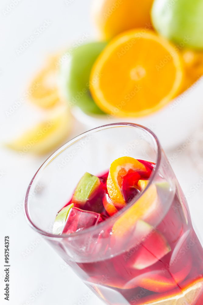 Sangria and ingredients on white wood background Sangria and ingredients on white wood background