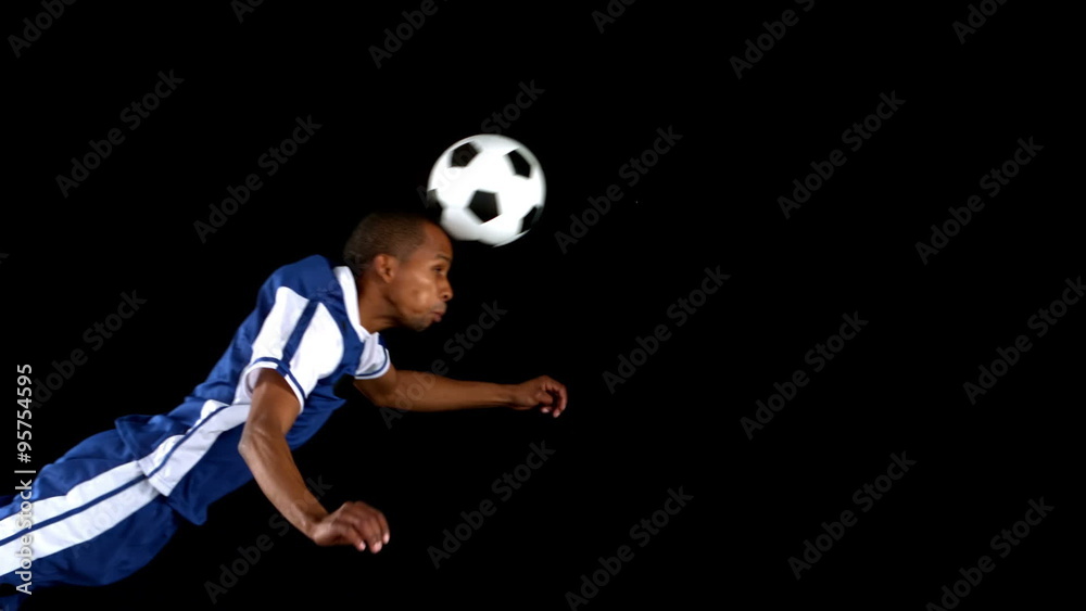 Soccer player playing with a soccer ball 