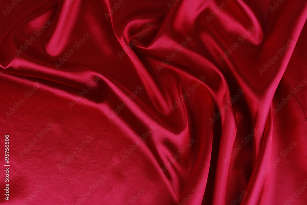 Obraz premium Red silk fabric material sheet texture background