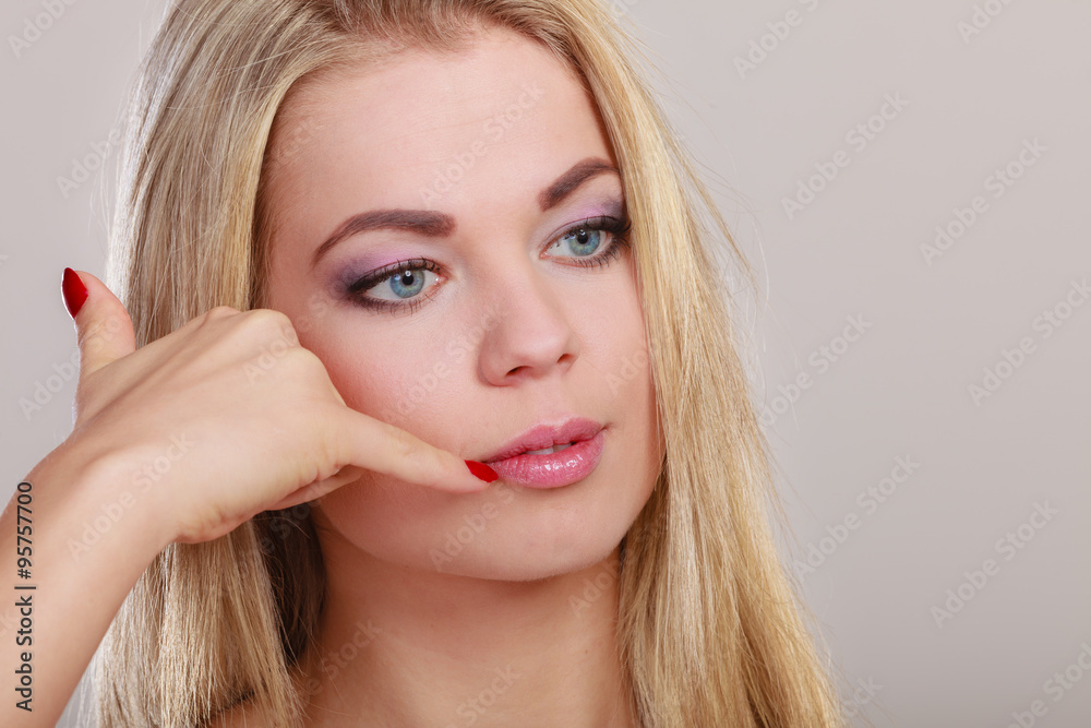 Woman making call me gesture phone hand sign. Woman making call me gesture phone hand sign.