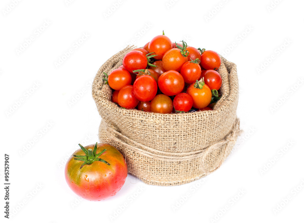 Organic tomatoes in basket Organic tomatoes in basket
