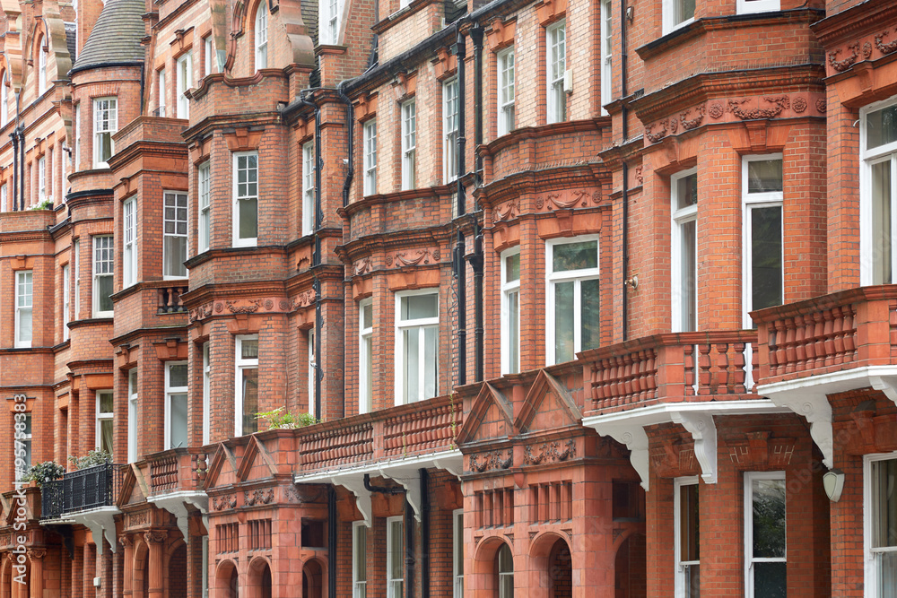 Red bricks english houses facade in London