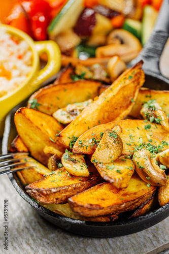 Fried potato with mushrooms and herbs